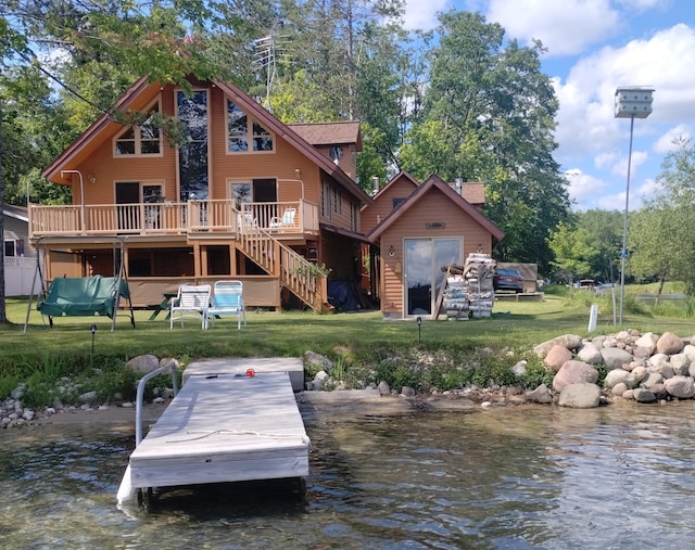 19241 Pine Tree Ct, Hillman, MI 49746 - back of house with a yard, stairway, a deck with water view, and a chimney