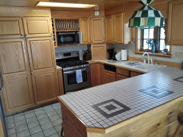 19241 Pine Tree Ct, Hillman, MI 49746 - kitchen with black microwave, tile counters, stainless steel range with gas stovetop, and decorative backsplash
