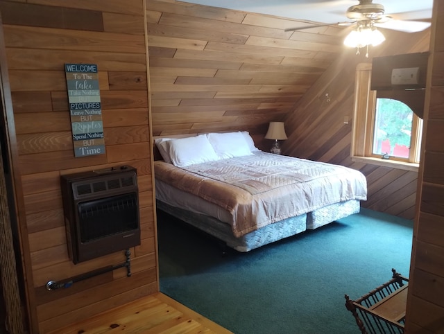 19241 Pine Tree Ct, Hillman, MI 49746 - bedroom featuring heating unit, lofted ceiling, wood walls, and wood finished floors