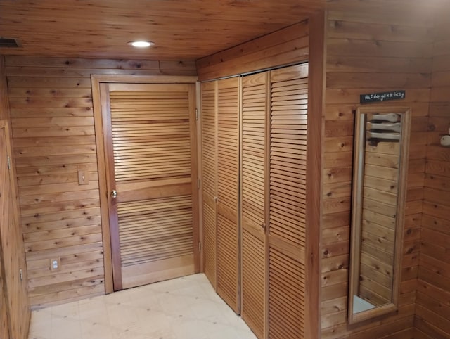 19241 Pine Tree Ct, Hillman, MI 49746 - detailed view of wooden walls, wooden ceiling, recessed lighting, and tile patterned floors