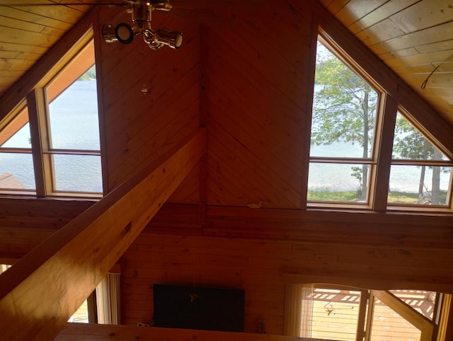 19241 Pine Tree Ct, Hillman, MI 49746 - detailed view of wood ceiling, wooden walls, nearby water, and a chandelier