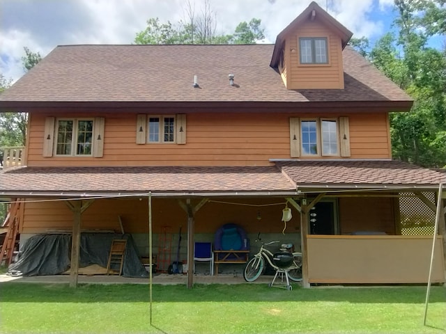 19241 Pine Tree Ct, Hillman, MI 49746 - back of house with roof with shingles and a lawn
