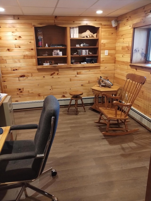 19241 Pine Tree Ct, Hillman, MI 49746 - office space featuring wooden walls, wood finished floors, a baseboard radiator, and recessed lighting