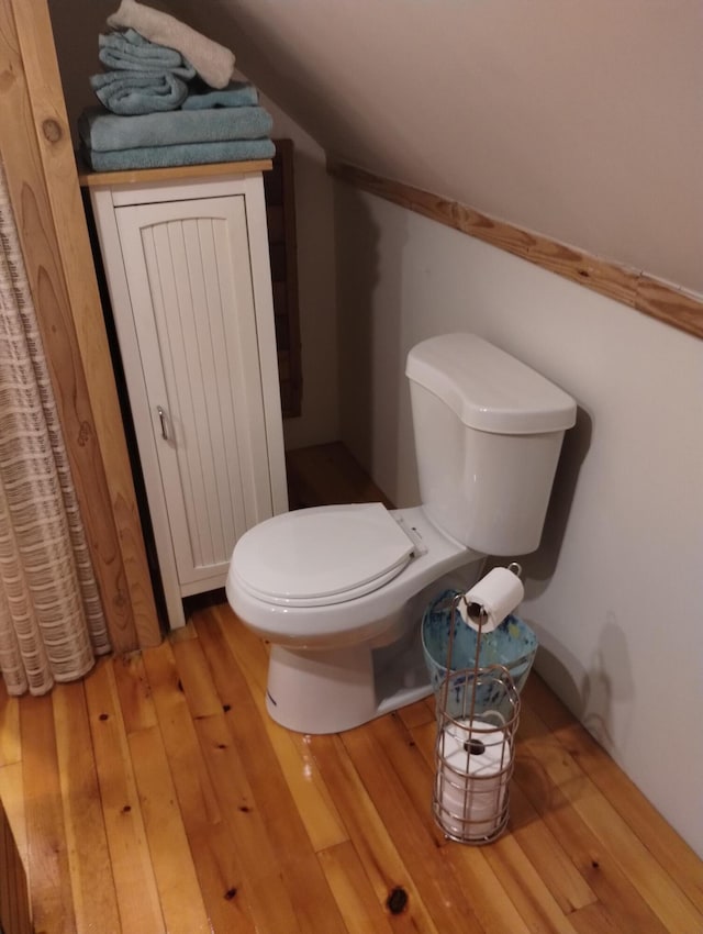 19241 Pine Tree Ct, Hillman, MI 49746 - bathroom featuring wood finished floors and toilet