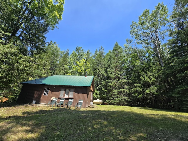 1987 N Galbraith Rd, Mio, MI 48647 - view of green lawn featuring a wooded view