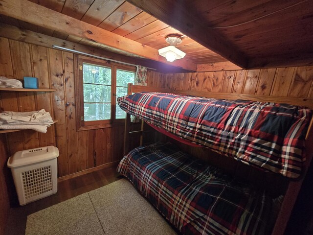 1987 N Galbraith Rd, Mio, MI 48647 - bedroom featuring a wood ceiling with exposed beams, wood finished floors, and wood walls