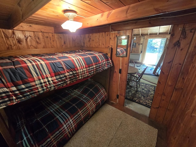 1987 N Galbraith Rd, Mio, MI 48647 - carpeted bedroom with wooden walls, wooden ceiling, access to outside, and cooling unit