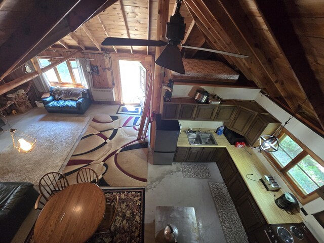 1987 N Galbraith Rd, Mio, MI 48647 - living room with lofted ceiling, carpet floors, and wood walls