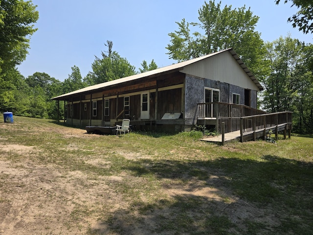 8361 Brookfield Dr, Elmira, MI 49730 - back of property with a deck and a yard