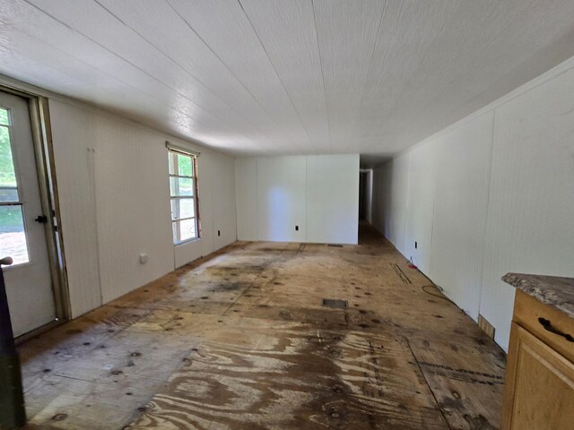 8361 Brookfield Dr, Elmira, MI 49730 - spare room featuring a decorative wall