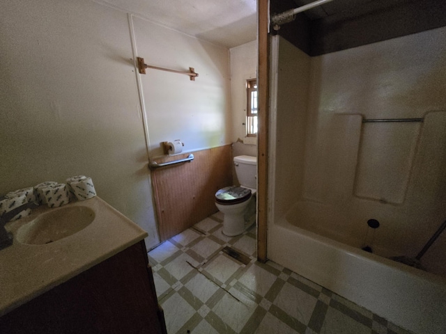 8361 Brookfield Dr, Elmira, MI 49730 - bathroom featuring tile patterned floors, vanity,  shower combination, and wainscoting