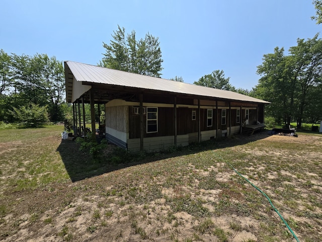 8361 Brookfield Dr, Elmira, MI 49730 - view of front of property with a carport