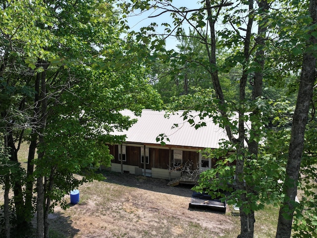8361 Brookfield Dr, Elmira, MI 49730 - rear view of property with covered porch and a metal roof