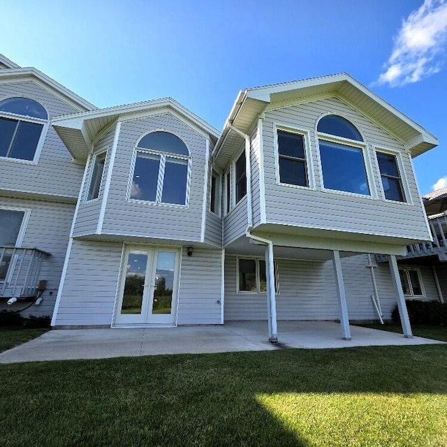 176 Long Rapids Rd, Alpena, MI 49707 - rear view of house featuring a yard and a patio