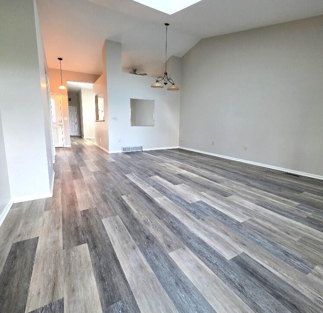 176 Long Rapids Rd, Alpena, MI 49707 - unfurnished living room with wood finished floors and lofted ceiling