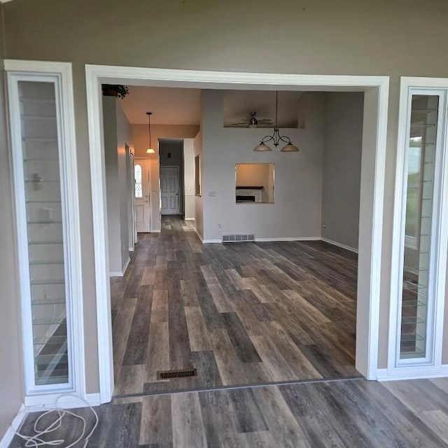 176 Long Rapids Rd, Alpena, MI 49707 - unfurnished living room featuring wood finished floors and ceiling fan
