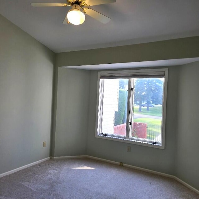 176 Long Rapids Rd, Alpena, MI 49707 - carpeted spare room with baseboards and ceiling fan