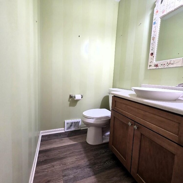 176 Long Rapids Rd, Alpena, MI 49707 - half bath featuring wood finished floors and vanity