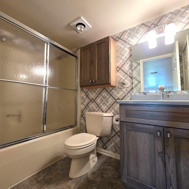 176 Long Rapids Rd, Alpena, MI 49707 - full bathroom featuring vanity, bath / shower combo with glass door, wallpapered walls, and tile patterned flooring