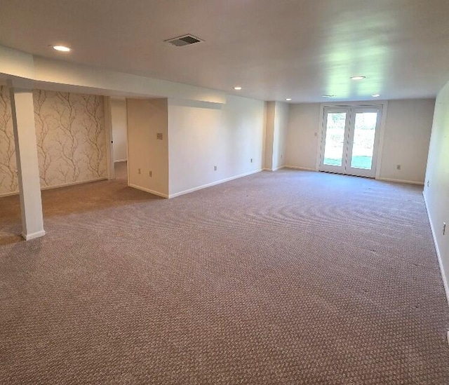 176 Long Rapids Rd, Alpena, MI 49707 - below grade area featuring carpet flooring, recessed lighting, and french doors