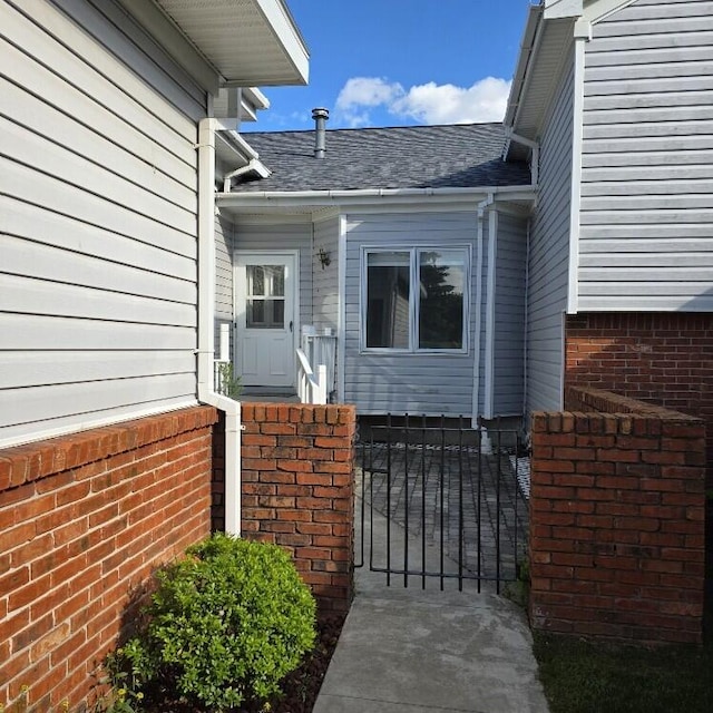 176 Long Rapids Rd, Alpena, MI 49707 - doorway to property featuring a shingled roof