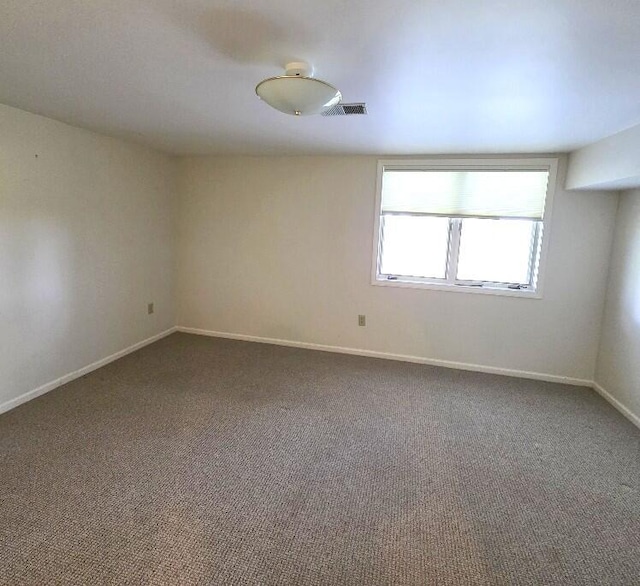 176 Long Rapids Rd, Alpena, MI 49707 - empty room featuring carpet flooring and baseboards