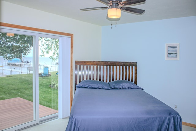 11920 W Shore Dr, Houghton Lake, MI 48629 - bedroom featuring access to exterior and ceiling fan