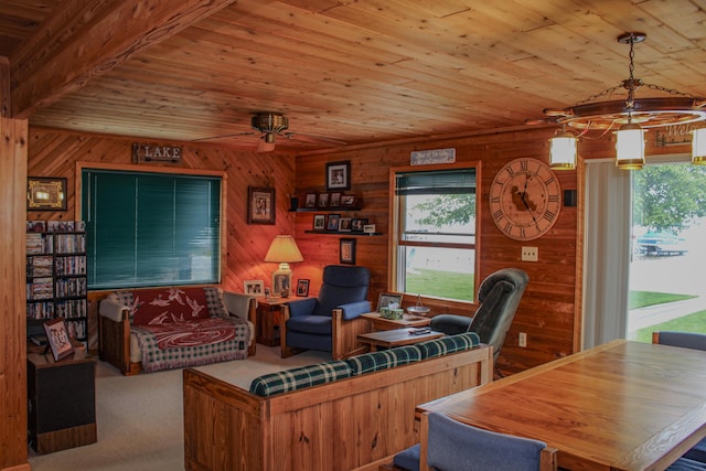 11920 W Shore Dr, Houghton Lake, MI 48629 - living room featuring wood ceiling, healthy amount of natural light, a chandelier, wooden walls, and carpet flooring
