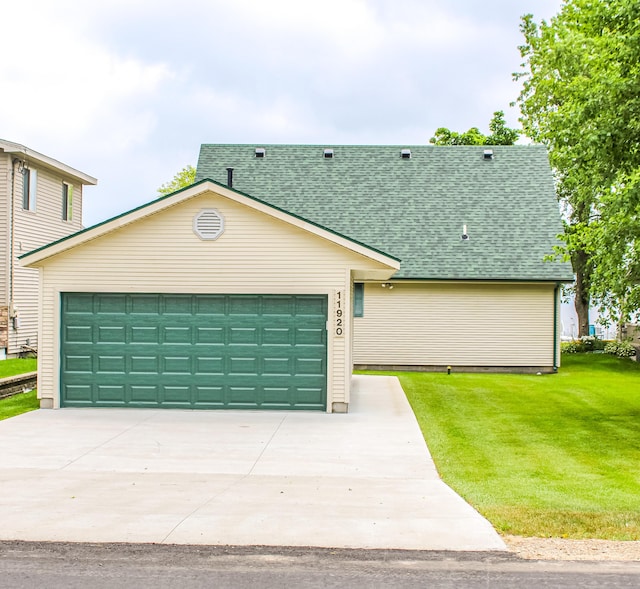 11920 W Shore Dr, Houghton Lake, MI 48629 - view of front of house with a shingled roof, a front lawn, an attached garage, and driveway