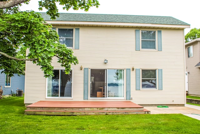 11920 W Shore Dr, Houghton Lake, MI 48629 - back of property with a lawn