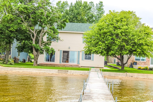 11920 W Shore Dr, Houghton Lake, MI 48629 - dock with a water view and a lawn