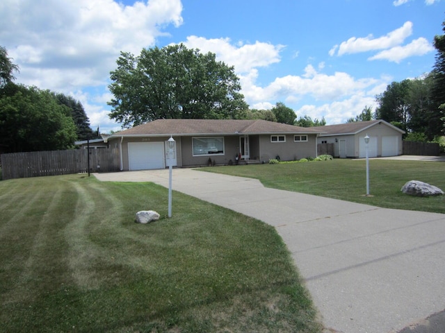 203 S Case St, Marion, MI 49665 - ranch-style house with a garage and concrete driveway