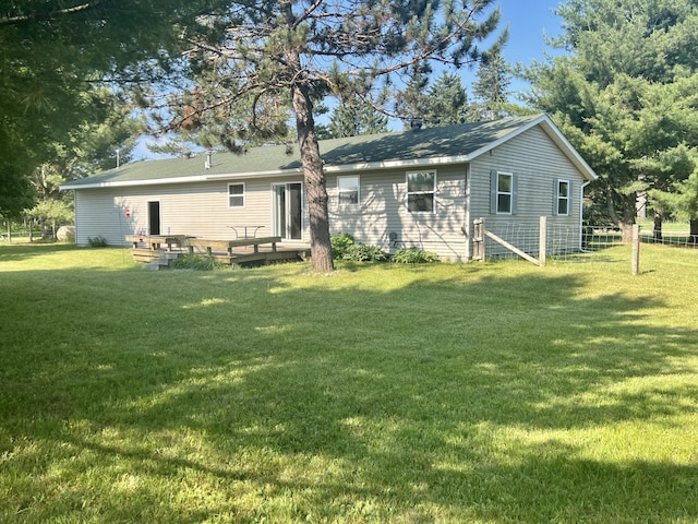7125 S Military Rd, Grayling, MI 49738 - back of property with a wooden deck
