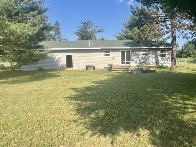 7125 S Military Rd, Grayling, MI 49738 - rear view of property with a yard