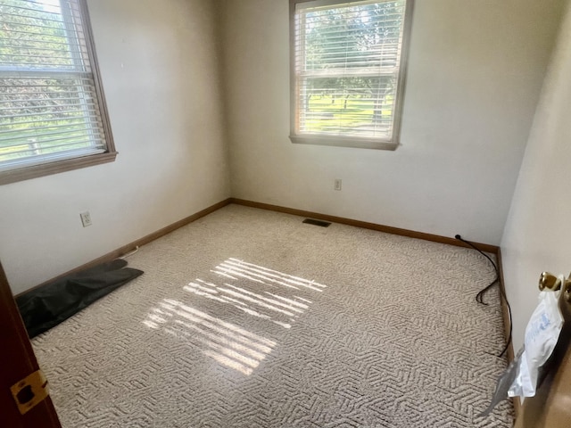 7125 S Military Rd, Grayling, MI 49738 - unfurnished room featuring light colored carpet