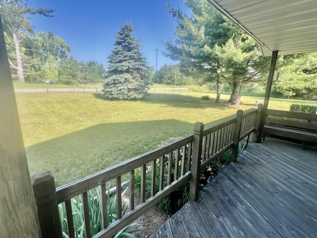 7125 S Military Rd, Grayling, MI 49738 - wooden deck with a yard