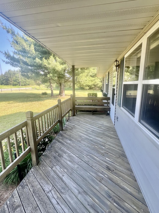 7125 S Military Rd, Grayling, MI 49738 - wooden terrace with a yard