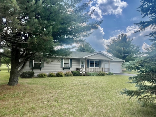 7125 S Military Rd, Grayling, MI 49738 - ranch-style home featuring a porch, a garage, a front lawn, and asphalt driveway