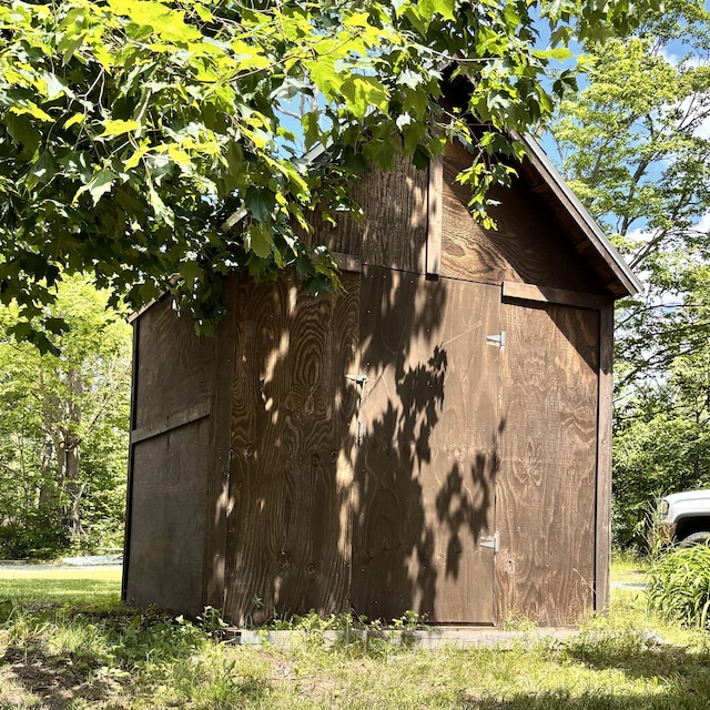 10279 N Sherman Rd, Frederic, MI 49733 - view of home's exterior featuring an outdoor structure and a barn