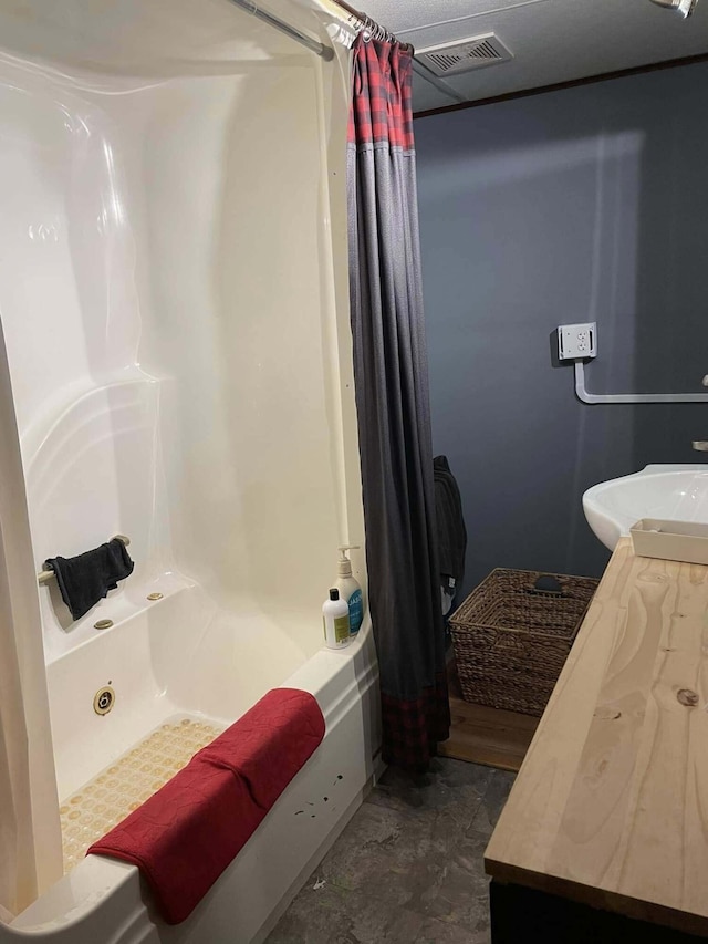 10279 N Sherman Rd, Frederic, MI 49733 - full bath with shower / bath combo and vanity