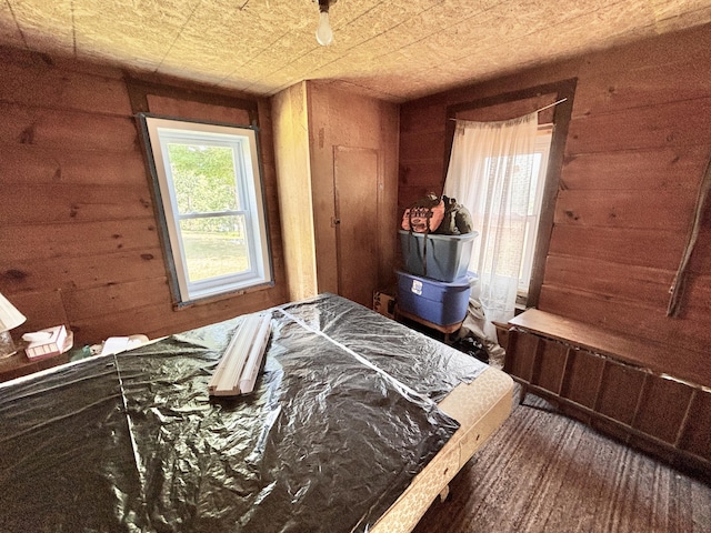 1950 Highbank Trl, Lewiston, MI 49756 - carpeted bedroom with wooden walls