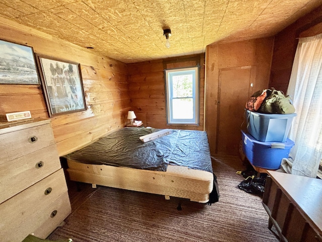 1950 Highbank Trl, Lewiston, MI 49756 - carpeted bedroom featuring wood walls