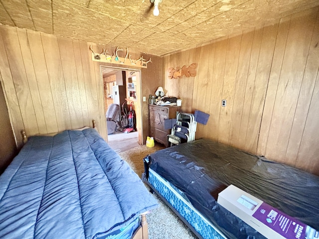 1950 Highbank Trl, Lewiston, MI 49756 - bedroom featuring carpet, wooden walls, and an ornate ceiling