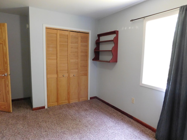 4616 Martin Dr, Frederic, MI 49733 - unfurnished bedroom with a closet and carpet floors