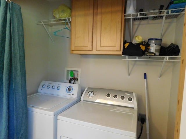 4616 Martin Dr, Frederic, MI 49733 - laundry area with washing machine and dryer and cabinet space