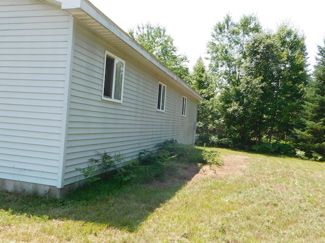 4616 Martin Dr, Frederic, MI 49733 - view of property exterior featuring a yard