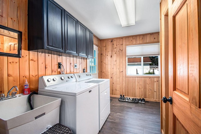 2145 Mustang St, Saint Helen, MI 48656 - laundry room with cabinet space, washer and dryer, wood walls, and dark wood finished floors