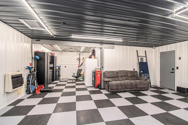 2145 Mustang St, Saint Helen, MI 48656 - garage featuring heating unit and wood walls