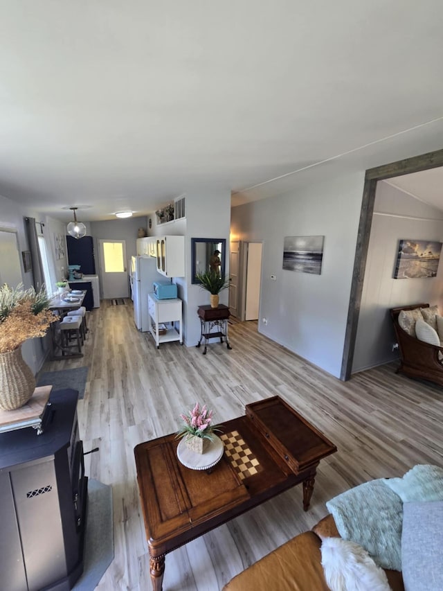 506 S N St, Alpena, MI 49707 - living room with light wood-style floors