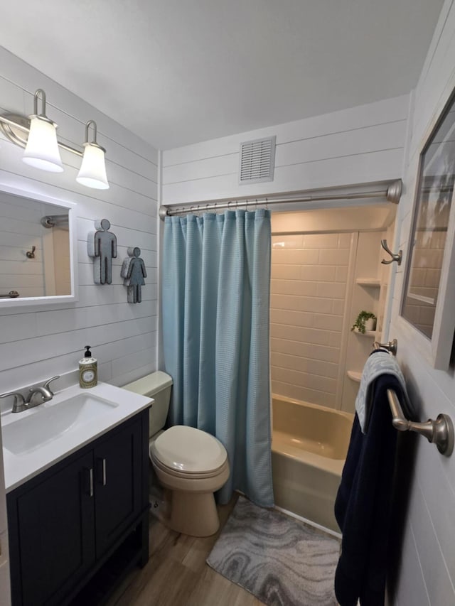 506 S N St, Alpena, MI 49707 - bathroom with wood finished floors, shower / bath combo, vanity, and wood walls